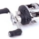 Black and silver reel body, with a double handle set up that is silver and black