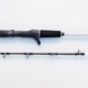 Rod displayed in two sections. The base and handle are black, and the rod is white and black with black guides