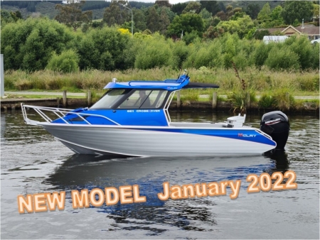 Blue and white boat with black motor, white rails and hard top canopy with white rails